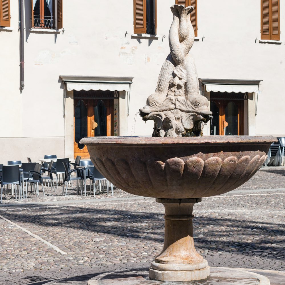 Historic fountain in a square of Mantua's old town